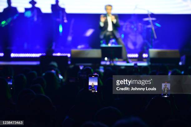 Atmosphere of fans watch legends Jose Luis Rodriguez "El Puma" in concert on they smart phone during 'Dia del Amor y La Amistad' at James L. Knight...