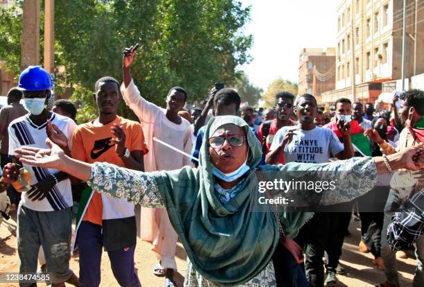 Sudanese protesters chant slogans as they march during a demonstration calling for civilian rule and denouncing the military administration, in the...