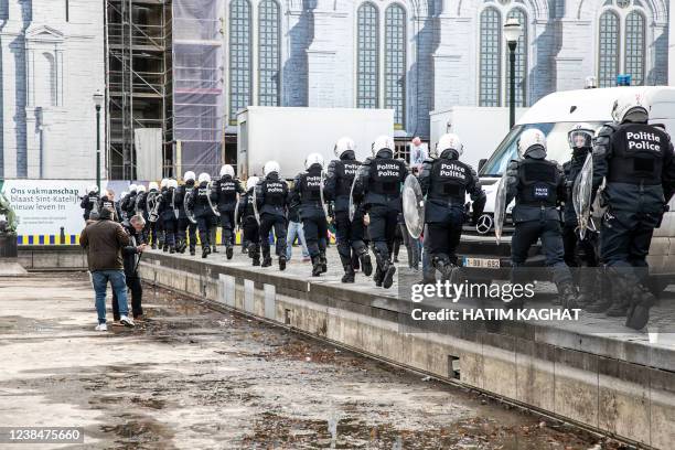 Protestors and riot police face off at the Sint-Katelijneplein - Place Sainte-Catherine in the city center of Brussels, at a protest action against...