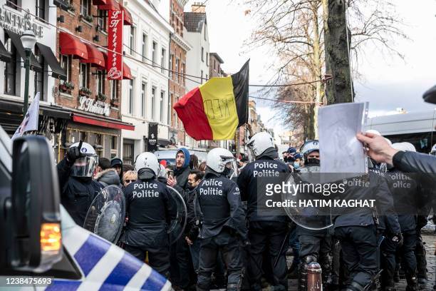 Protestors and riot police face off at the Sint-Katelijneplein - Place Sainte-Catherine in the city center of Brussels, at a protest action against...