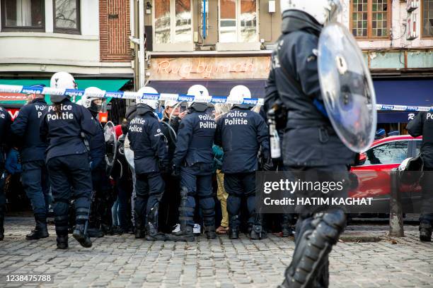 Protestors and riot police face off at the Sint-Katelijneplein - Place Sainte-Catherine in the city center of Brussels, at a protest action against...