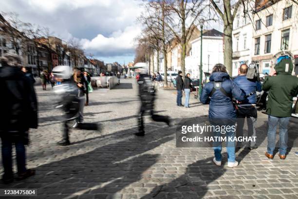 Some people gather at the Sint-Katelijneplein - Place Sainte-Catherine in the city center of Brussels for a protest action against corona-measures...