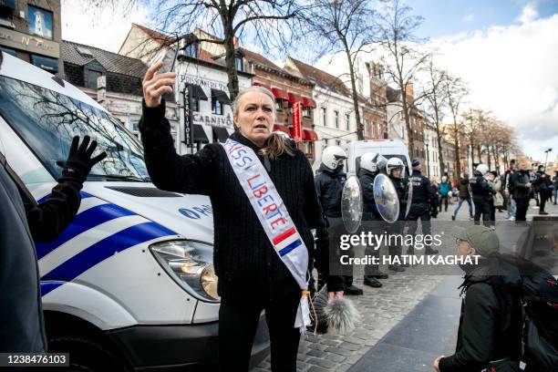 Some people gather at the Sint-Katelijneplein - Place Sainte-Catherine in the city center of Brussels for a protest action against corona-measures...