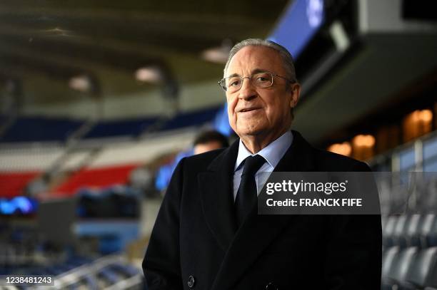 Real Madrid's president Florentino Perez looks on as he attends his team's training session at the Parc des Princes stadium in Paris on February 14,...