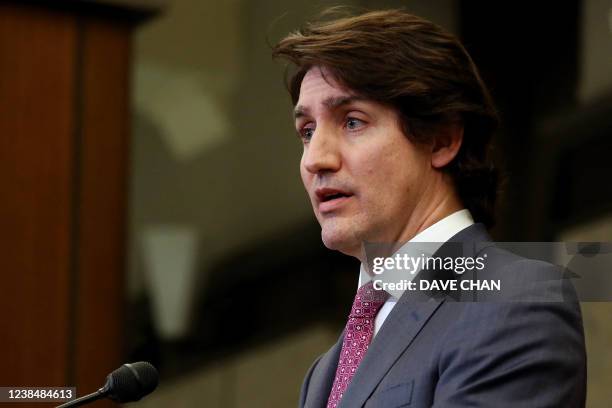 Canada's Prime Minister Justin Trudeau comments on the on going truckers mandate protest during a news conference on Parliament Hill in Ottawa,...