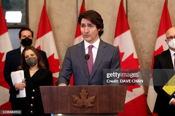 Canada's Prime Minister Justin Trudeau comments on the on going truckers mandate protest during a news conference on Parliament Hill in Ottawa,...