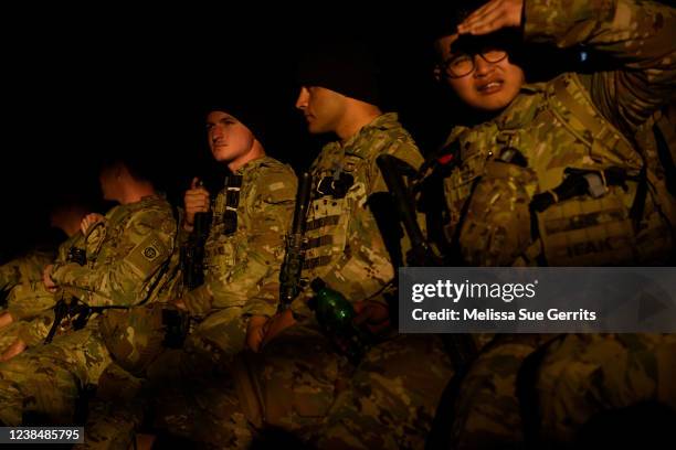 Soldiers with the 82nd Airborne division wait to deploy to Poland on February 14, 2022 at Fort Bragg, Fayetteville, North Carolina. An estimated...