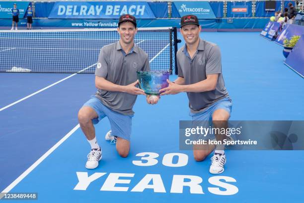 Bob Bryan and Mike Bryan pose together after an exhibition match at the ATP Delray Beach Open on February 13 at the Delray Beach Stadium & Tennis...