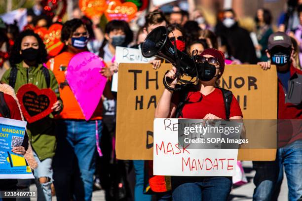 Emily Bird carrying a megaphone, leads the protest through campus grounds. Students gathered on Valentines day in a protest to ask their university...