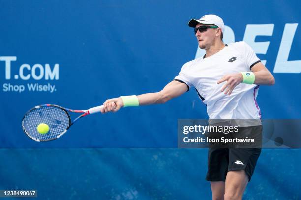 Denis Istomin competes during the qualifying round of the ATP Delray Beach Open on February 13 at the Delray Beach Stadium & Tennis Center in Delray...