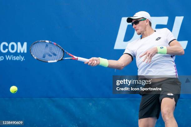 Denis Istomin competes during the qualifying round of the ATP Delray Beach Open on February 13 at the Delray Beach Stadium & Tennis Center in Delray...