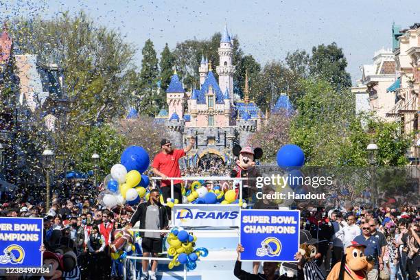 In this handout photo provided by Disneyland Resort, MVP Cooper Kupp, Aaron Donald and Matthew Stafford of the Los Angeles Rams celebrate their Super...