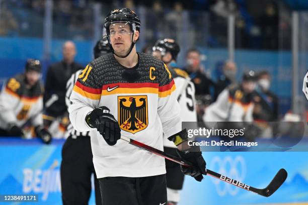 Moritz Muller of Germany looks on at the men's ice hockey playoff qualifications match between Slovakia and Germany during the Beijing 2022 Winter...