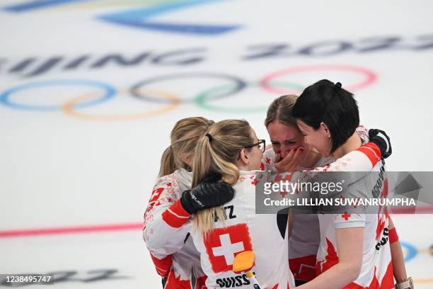 Switzerland's Silvana Tirinzoni, Alina Patz, Melanie Barbezat and Esther Neuenschwander celebrate during the womens round robin session 9 game of the...