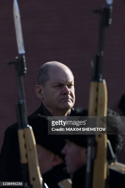 German Chancellor Olaf Scholz takes part in a wreath-laying ceremony at the Tomb of the Unknown Soldier by the Kremlin Wall in Moscow, on February...