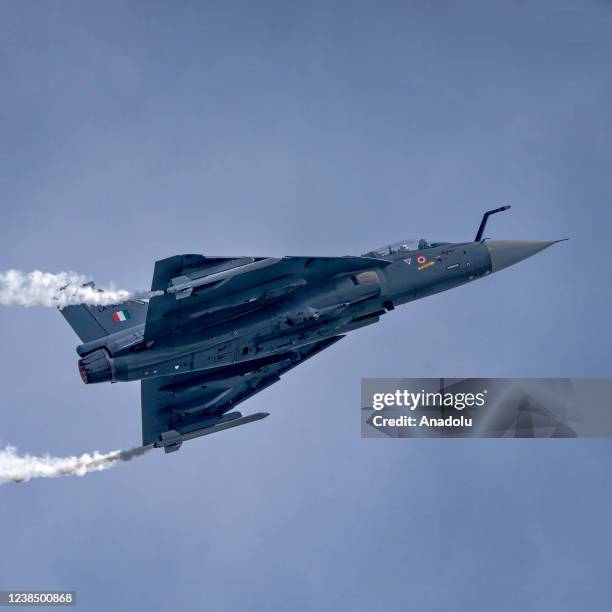 Indian Air Force's fighter aircraft Tejas takes part in an aerial display during the Singapore Airshow 2022 at Changi Exhibition Centre in Singapore,...