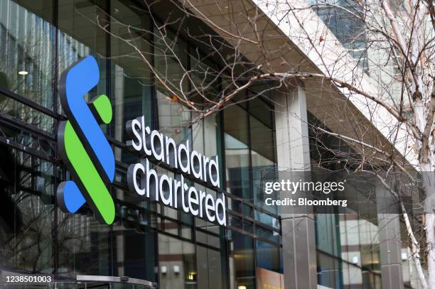 Sign above the entrance to the headquarters of Standard Chartered Plc in London, U.K., on Monday, Feb. 14, 2022. European banks have largely thrived...