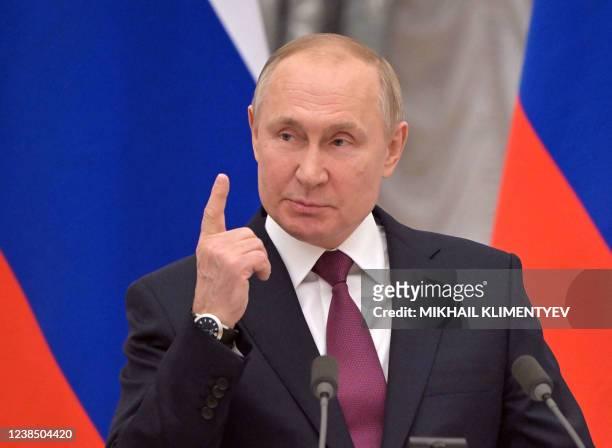 Russian President Vladimir Putin speaks during a joint press conference with German Chancellor following their meeting over Ukraine security at the...