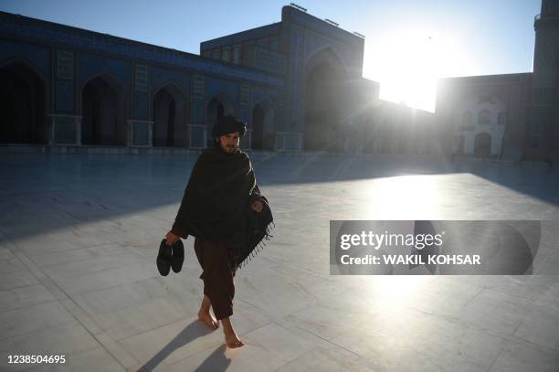 Member of the Taliban walks in the courtyard of Jami mosque, in Herat on February 15, 2022.