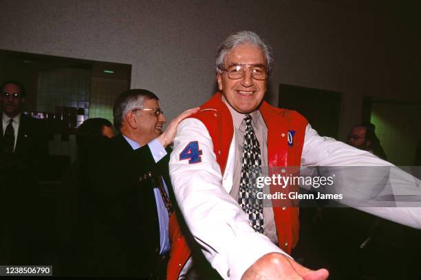 Commissioner David Stern assists Dolph Schayes with his jacket as the NBA celebrates the naming of the 50 greatest players during NBA All-Star...