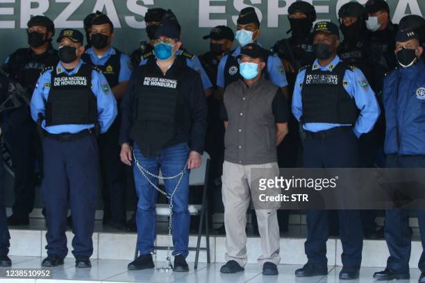 Honduran former President Juan Orlando Hernandez is seen handcuffed at the headquarters of the Honduras Police, after receiving an extradition order...