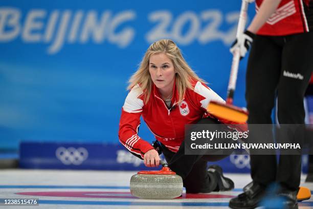 Canadas Jennifer Jones curls the stone during the womens round robin session 10 game of the Beijing 2022 Winter Olympic Games curling competition...