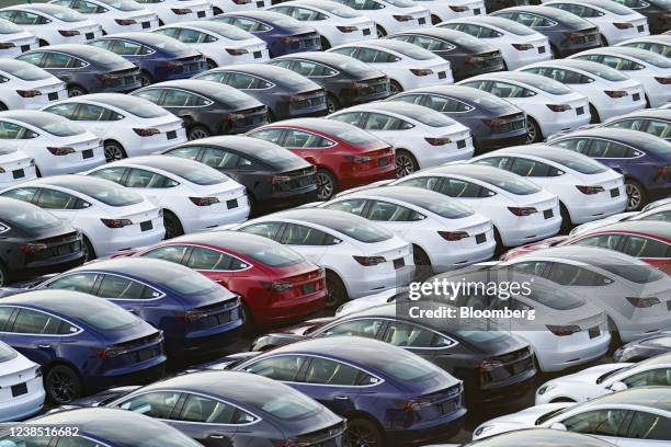 Tesla Inc. Vehicles in a parking lot after arriving at a port in Yokohama, Japan, on Monday, Feb. 14, 2022. Japan is scheduled to release trade...