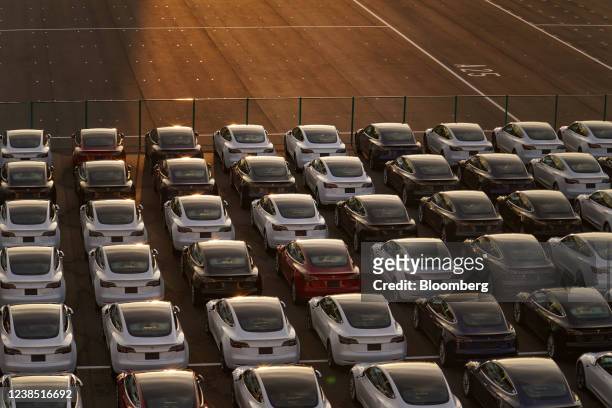 Tesla Inc. Vehicles in a parking lot after arriving at a port in Yokohama, Japan, on Monday, Feb. 14, 2022. Japan is scheduled to release trade...