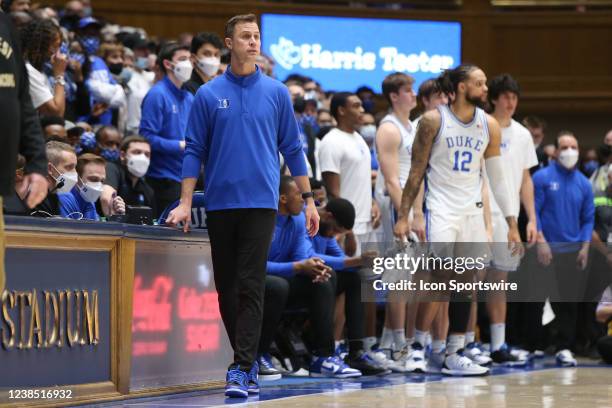 Duke Blue Devils associate head coach Jon Scheyer, in place of Duke Blue Devils head coach Mike Krzyzewski who felt sick after the first half, looks...