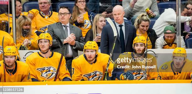 Head coach John Hynes and assistant coach Dan Lambert of the Nashville Predators watch the action against the Washington Capitals during an NHL game...