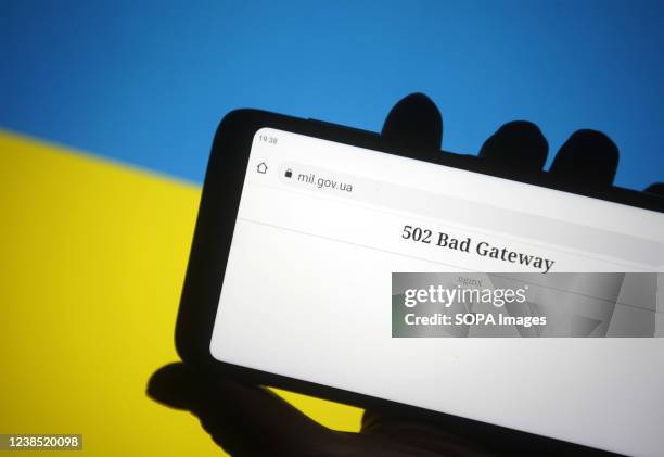 In this photo illustration, the 502 Bad Gateway message is seen on Ministry of Defence of Ukraine official webpage displayed on a smartphone screen...