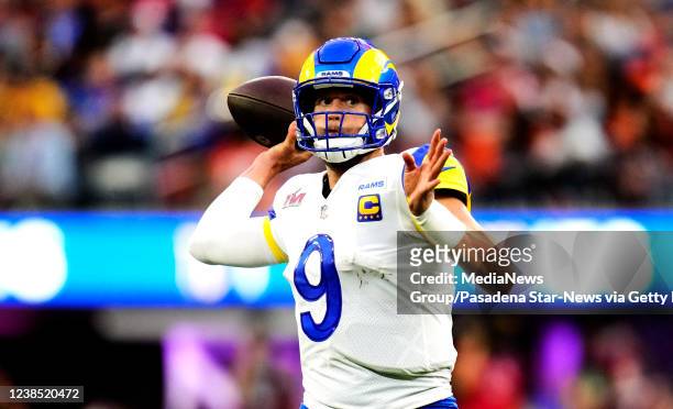 Quarterback Matthew Stafford of the Los Angeles Rams passes against the Cincinnati Bengals in the first half of Super Bowl LVI at SoFi Stadium in...