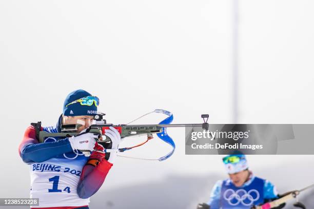 Vetle Sjaastad Christiansen of Norway at the shooting range during the men´s biathlon relay during the Beijing 2022 Winter Olympics at National...