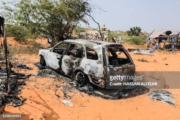 The remains of a police car following an explosion provocked by Al-Shabaab militants' during an attacke to a police station on the outskirts of...