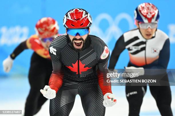 Canada's Steven Dubois reacts after competing in the final A of the men's 5000m relay short track speed skating event during the Beijing 2022 Winter...