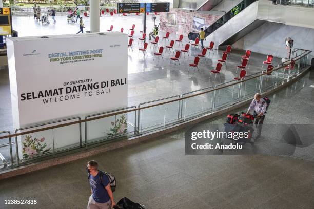 International passengers walks as they arrives from Singapore at I Gusti Ngurah Rai International Airport in Kuta, Bali, Indonesia on February 16,...