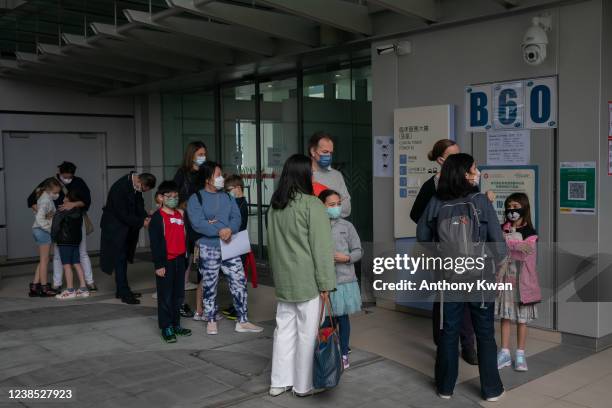Children and parents line up to receive BioNTech COVID-19 vaccine at Hong Kong Children's Hospital on February 16, 2022 in Hong Kong, China. Hong...