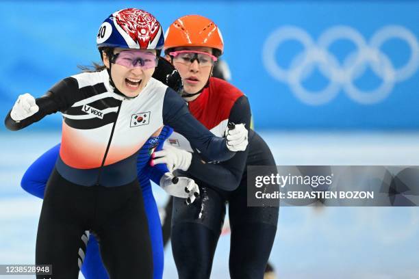 South Korea's Choi Min-jeong reacts as she competes with Netherlands' Suzanne Schulting during the final A of the women's 1500m short track speed...