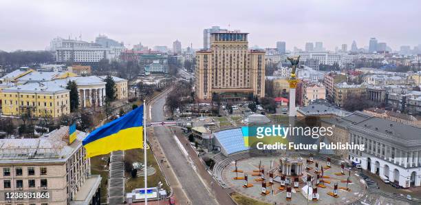 Large Ukrainian flag is pictured on the Globus shopping mall in Maidan Nezalezhnosti on the Day of Unity, Kyiv, capital of Ukraine. On February 14,...