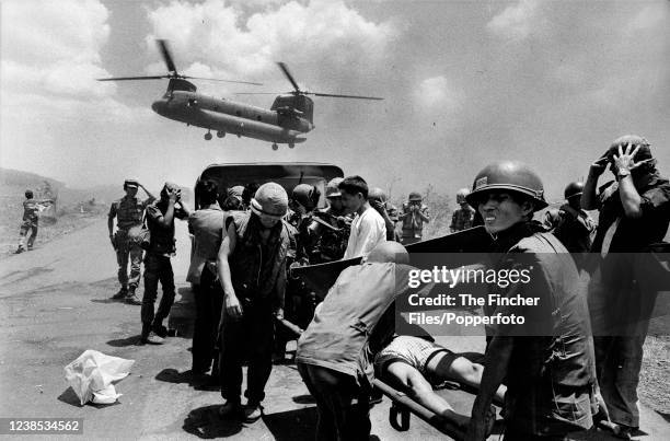 Evacuations of the wounded by South Vietnamese Army soldiers on Highway One, the battle-scarred road from Xuan Loc to Saigon, whilst a South...