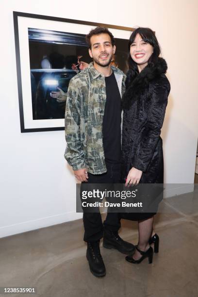 Jordan Saul and Daisy Lowe attend a private view of photographer Dave Benett's new exhibition "Great Shot, Kid" in partnership with Perrier Jouet at...