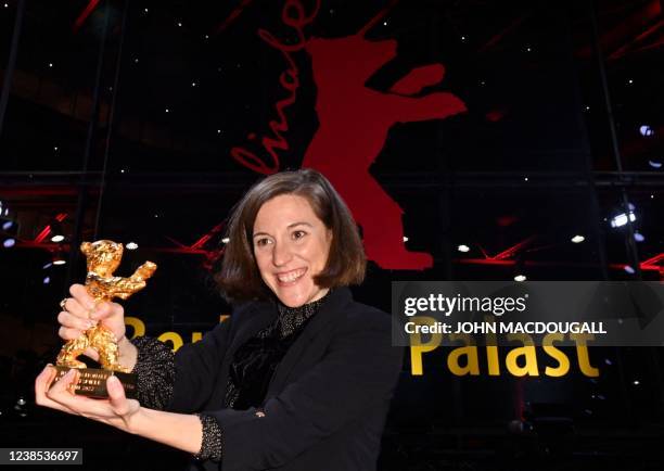 Spanish director and screenwriter Carla Simon poses with her Golden Bear for Best Film for the film "Alcarras"after the awards ceremony of the 72nd...