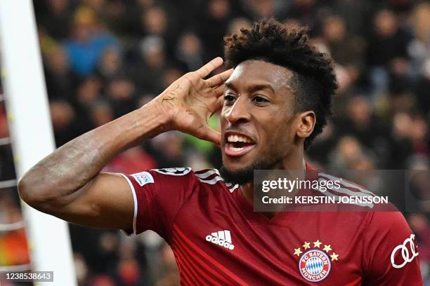 Bayern Munich's French forward Kingsley Coman celebrates scoring the 1-1 goal during the UEFA Champions League last-16, first-leg football match RB...