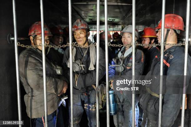 Miners prepare to down to an underground coal mine in Huaibei in China's eastern Anhui province on February 16, 2022. - China OUT / China OUT