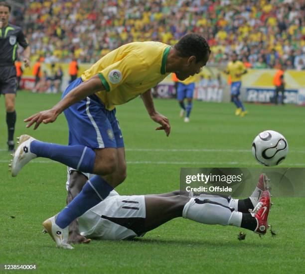 Football World Cup, Brazil v Ghana, Cafu of Brazil watches as Sulley Muntari of Ghana slips on the turf.