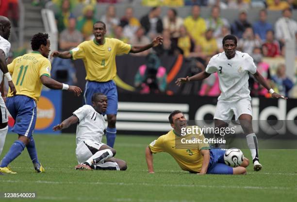 Football World Cup, Brazil v Ghana, Lucio of Brazil is brought down by Sulley Muntari of Ghana.