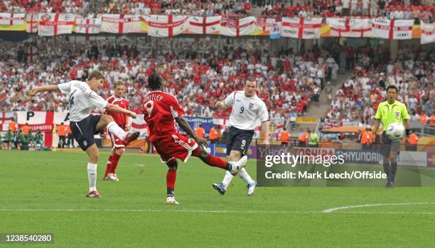 Football World Cup Group B, England v Trinidad & Tobago, Wayne Rooney of England watches as Steve Gerrard of England scores the 2nd goal for England.