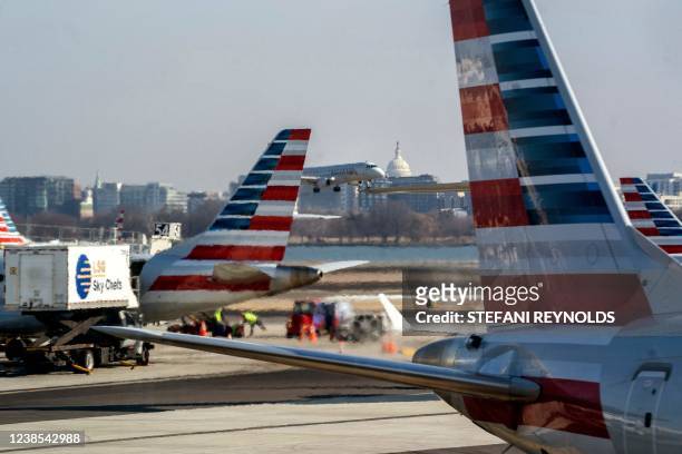 An American Eagle passenger plane approaches for landing at Ronald Reagan Washington National Airport in Airport in Arlington, Virginia, on February...