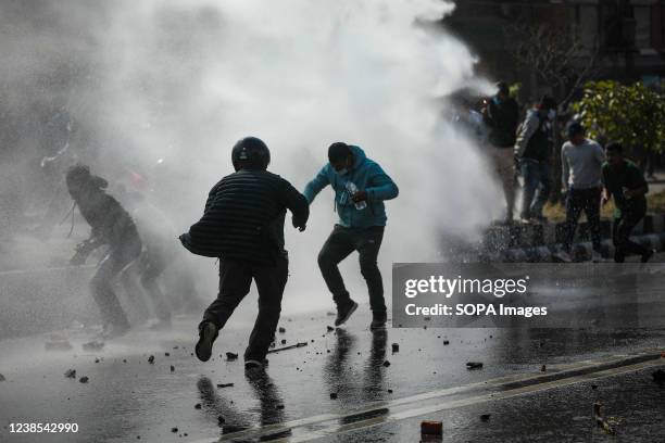 Protesters hurl bricks and stones at the riot police during a protest in Kathmandu. Different political parties youth wings clash with Nepal police...