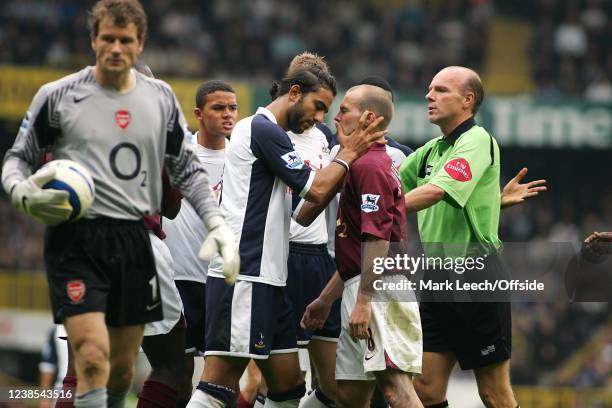 Premiership Football, Tottenham Hotspur v Arsenal, Mido of Tottenham and Fredrik Ljungberg of Arsenal comes to grips after Arsenal goalkeeper Jens...